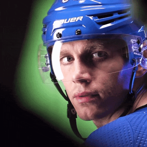A Hockey Player Wearing A Blue Helmet That Says Bauer On It GIF