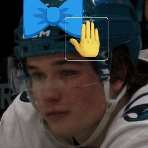 A Hockey Player Wearing A Blue Helmet With A Bow On It GIF