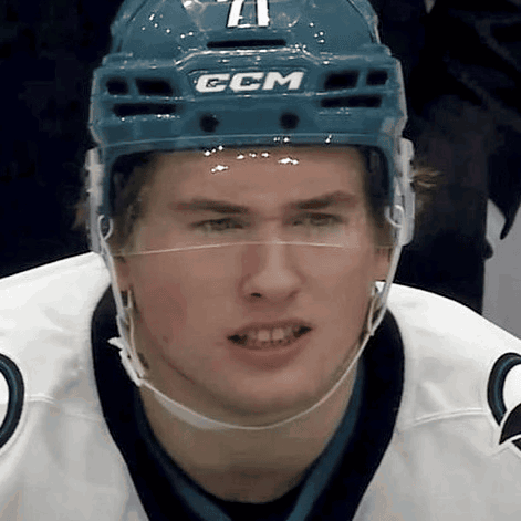 A Hockey Player Wearing A Blue Helmet With The Letters Ccm On It GIF