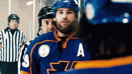 A Hockey Player Wearing A Blue Jersey With The Letter A On The Front GIF