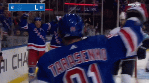 A Hockey Player Wearing A Blue Jersey With The Number 01 On It GIF