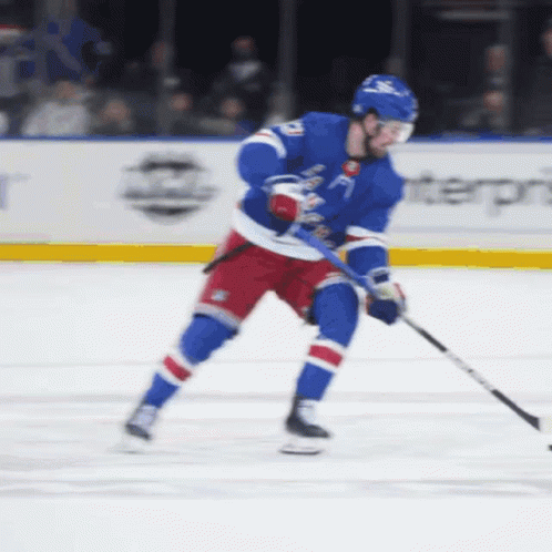 A Hockey Player Wearing A Blue Jersey With The Number 21 On It GIF