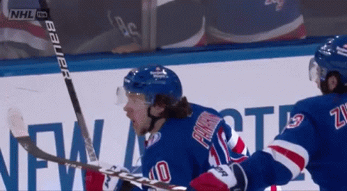A Hockey Player Wearing A Blue Jersey With The Number 40 On It GIF