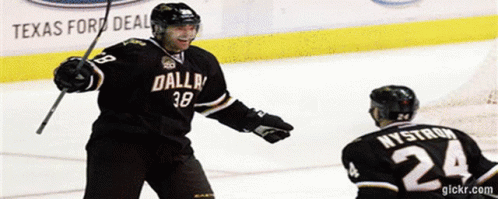 A Hockey Player Wearing A Dallas Jersey Stands On The Ice GIF