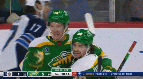 A Hockey Player Wearing A Green Jersey With Ria On The Front GIF