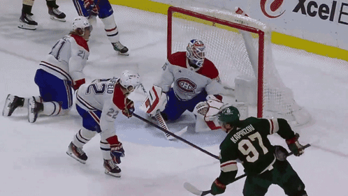 A Hockey Player Wearing A Green Jersey With The Letter A On The Sleeve GIF