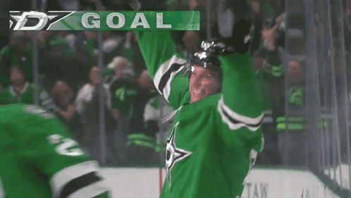 A Hockey Player Wearing A Green Jersey With The Number 2 On It GIF