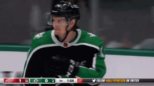 A Hockey Player Wearing A Green Jersey With The Word Ccm On The Front GIF
