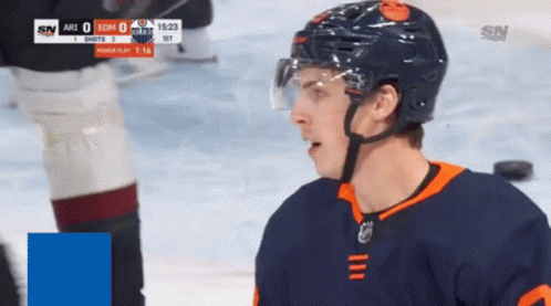 A Hockey Player Wearing A Helmet Stands On The Ice During A Game Against The Arizona Coyotes GIF