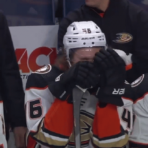A Hockey Player Wearing A Helmet That Says Bauer On It GIF
