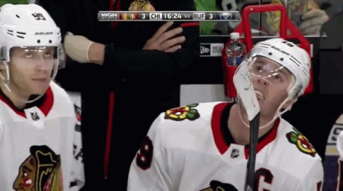 A Hockey Player Wearing A Helmet That Says Bauer On It GIF