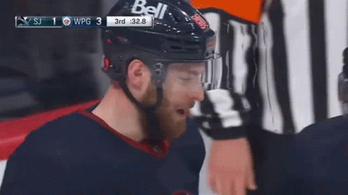 A Hockey Player Wearing A Helmet That Says Bell GIF