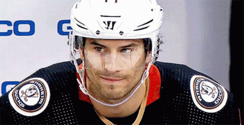 A Hockey Player Wearing A Helmet That Says Warrior On It GIF