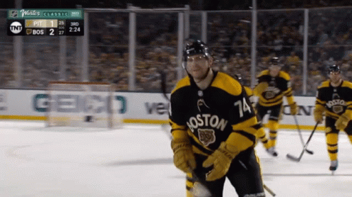 A Hockey Player Wearing A Jersey That Says Boston GIF