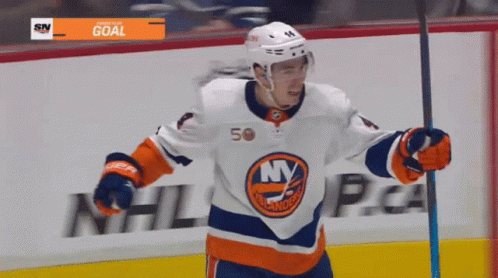 A Hockey Player Wearing A Jersey That Says Ny Is Holding A Stick GIF
