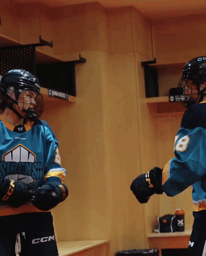 A Hockey Player Wearing A Jersey That Says Sirens On The Front GIF