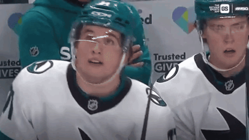A Hockey Player Wearing A Jersey That Says Trusted Give GIF