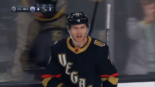 A Hockey Player Wearing A Jersey That Says Vegas GIF