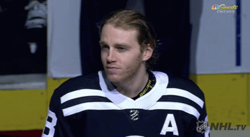 A Hockey Player Wearing A Jersey With The Letter A On The Front GIF