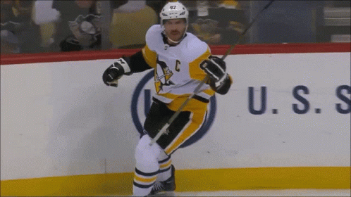 A Hockey Player Wearing A Jersey With The Letter C On It GIF