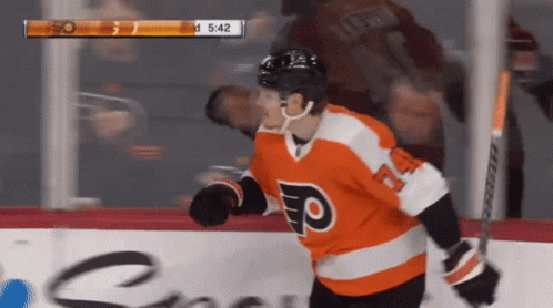 A Hockey Player Wearing A Jersey With The Letter F On The Front GIF
