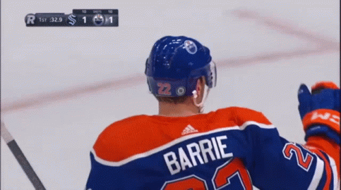A Hockey Player Wearing A Jersey With The Name Barrie On It GIF