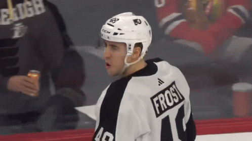 A Hockey Player Wearing A Jersey With The Name Frost On It GIF