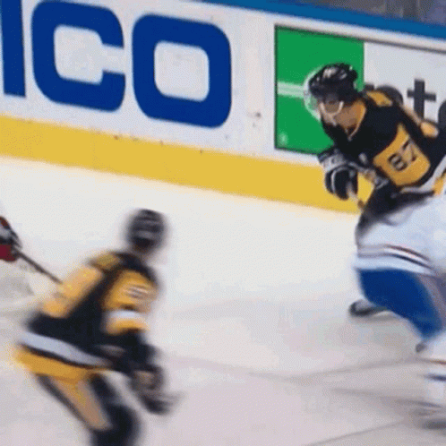 A Hockey Player Wearing A Jersey With The Number 17 On It Is Skating On The Ice GIF