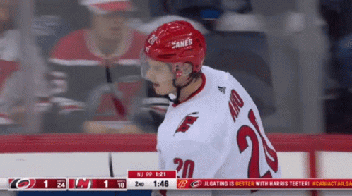 A Hockey Player Wearing A Jersey With The Number 20 GIF