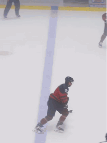 A Hockey Player Wearing A Jersey With The Number 23 On It GIF