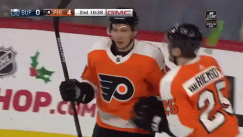 A Hockey Player Wearing A Jersey With The Number 23 On It GIF