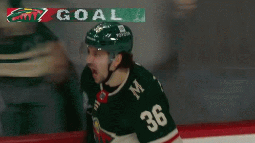 A Hockey Player Wearing A Jersey With The Number 36 On It GIF