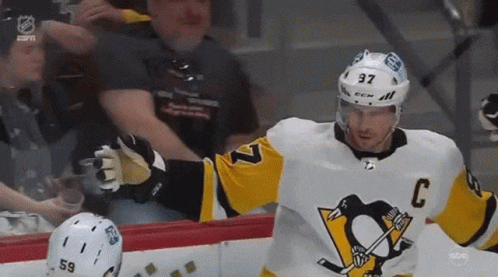 A Hockey Player Wearing A Jersey With The Number 37 On It GIF