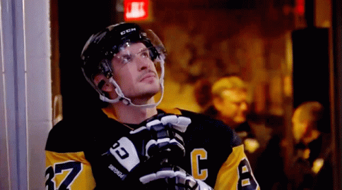 A Hockey Player Wearing A Jersey With The Number 37 On It GIF