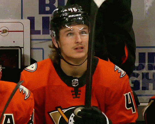 A Hockey Player Wearing A Jersey With The Number 4 GIF