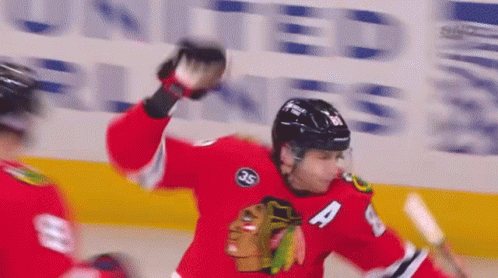 A Hockey Player Wearing A Jersey With The Number 4 On It GIF