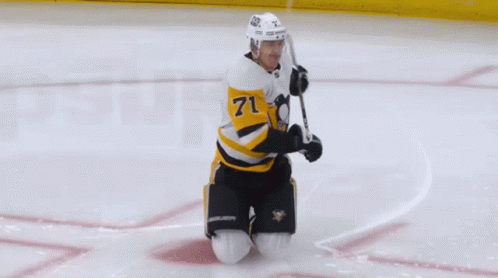A Hockey Player Wearing A Jersey With The Number 4 On It GIF