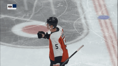 A Hockey Player Wearing A Jersey With The Number 5 On It GIF