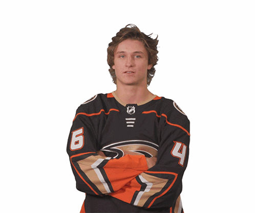 A Hockey Player Wearing A Jersey With The Number 6 And 4 On It GIF