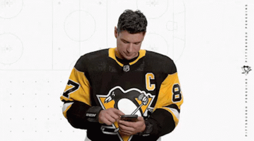 A Hockey Player Wearing A Jersey With The Number 8 On It GIF