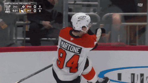 A Hockey Player Wearing A Jersey With The Number 94 GIF