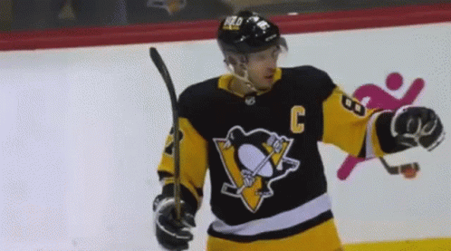A Hockey Player Wearing A Jersey With The Number C On It GIF