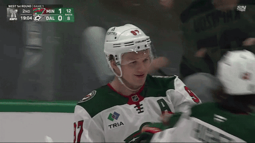 A Hockey Player Wearing A Jersey With The Word Tria On It GIF