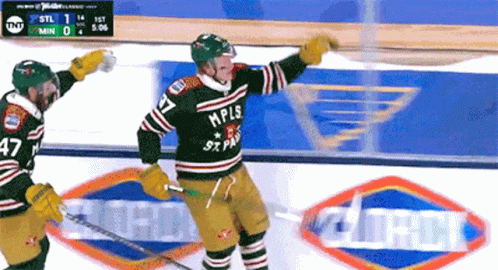 A Hockey Player Wearing A Mpls Jersey Celebrates A Goal GIF