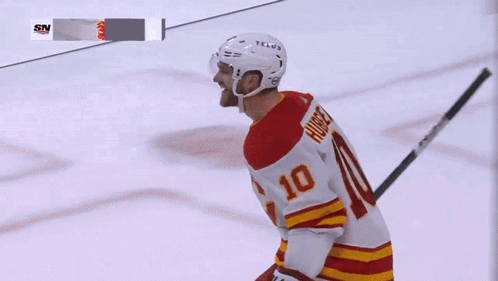 A Hockey Player Wearing A Number 10 Jersey GIF