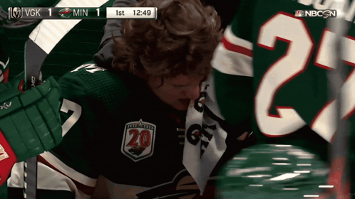 A Hockey Player Wearing A Number 20 Jersey GIF