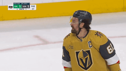 A Hockey Player Wearing A Number 6 Jersey Stands On The Ice GIF