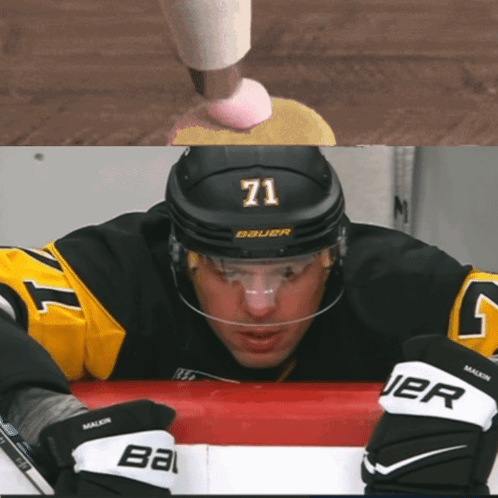 A Hockey Player Wearing A Number 71 Jersey GIF