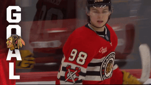A Hockey Player Wearing A Number 98 Jersey GIF