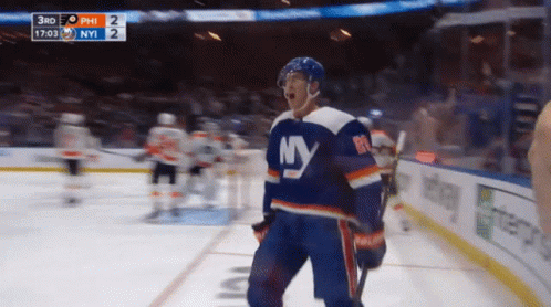 A Hockey Player Wearing A Ny Jersey Stands On The Ice GIF
